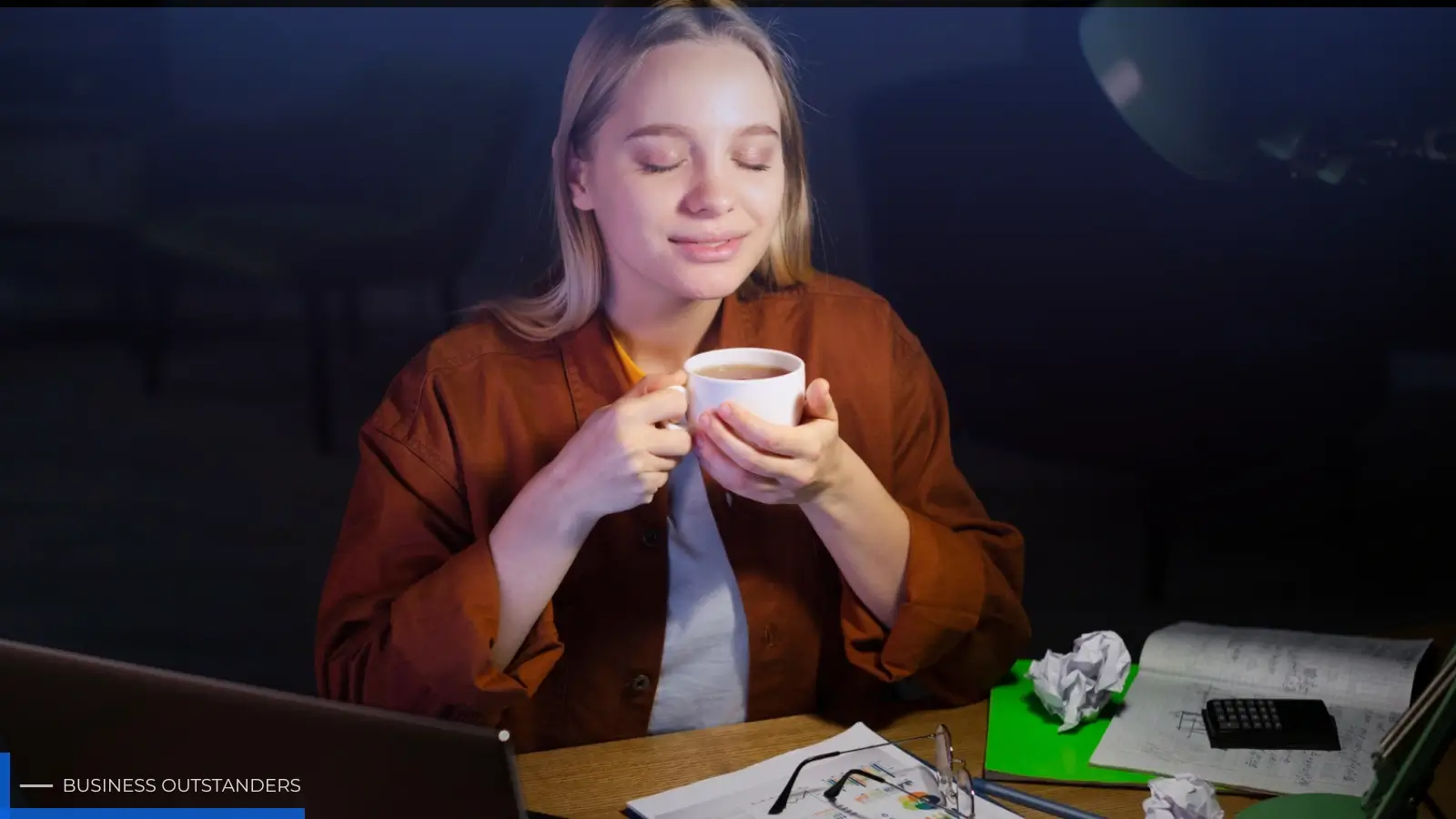 Student choosing between sting energy drink and coffee for late-night study session