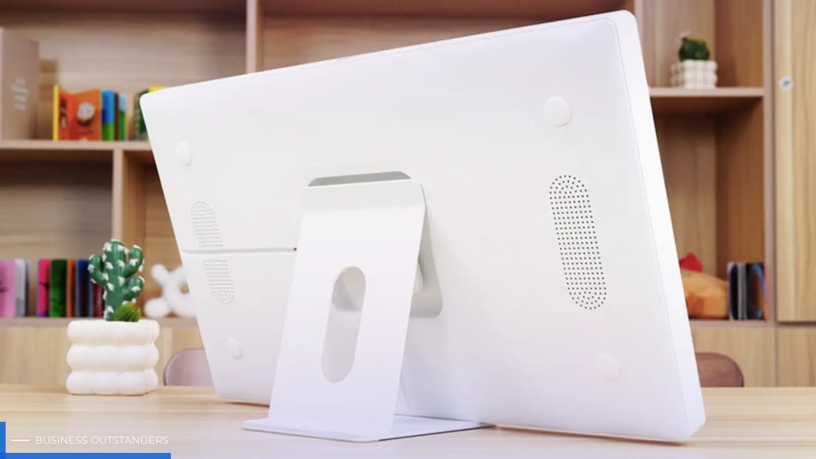 A minimal design chore tracker placed on a student dorm desk beside textbooks and a laptop