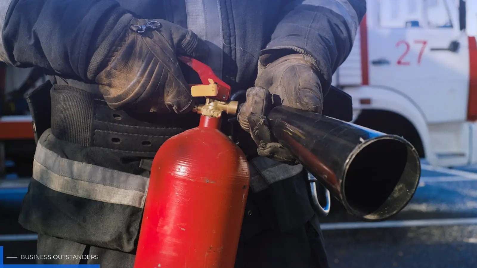 Construction site worker implementing fire safety measures and inspecting fire-rated building materials