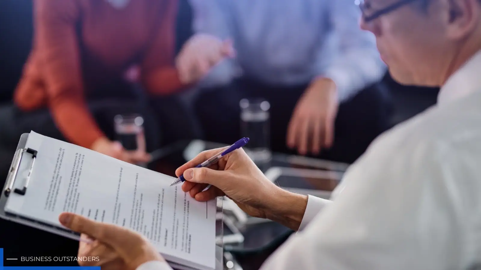 Person reviewing insurance documents and treatment options for rehab verification process