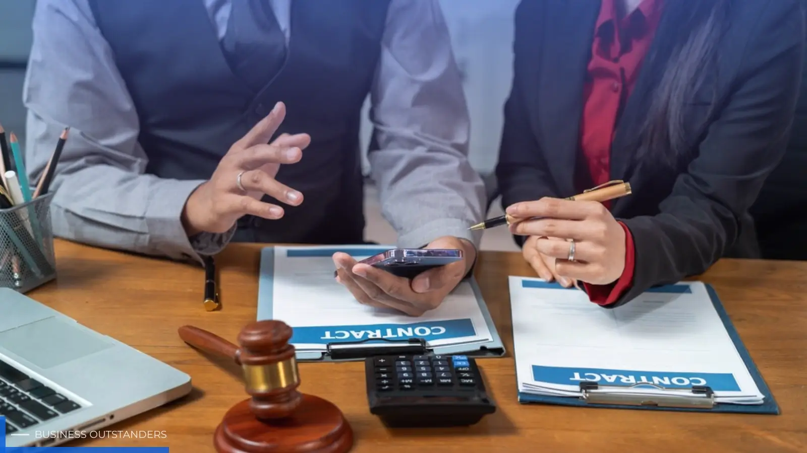 Business lawyer reviewing legal documents with a client in Panama City Beach Florida