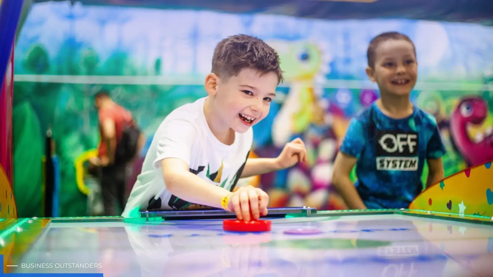 Children playing and having fun inside a colorful indoor family entertainment center