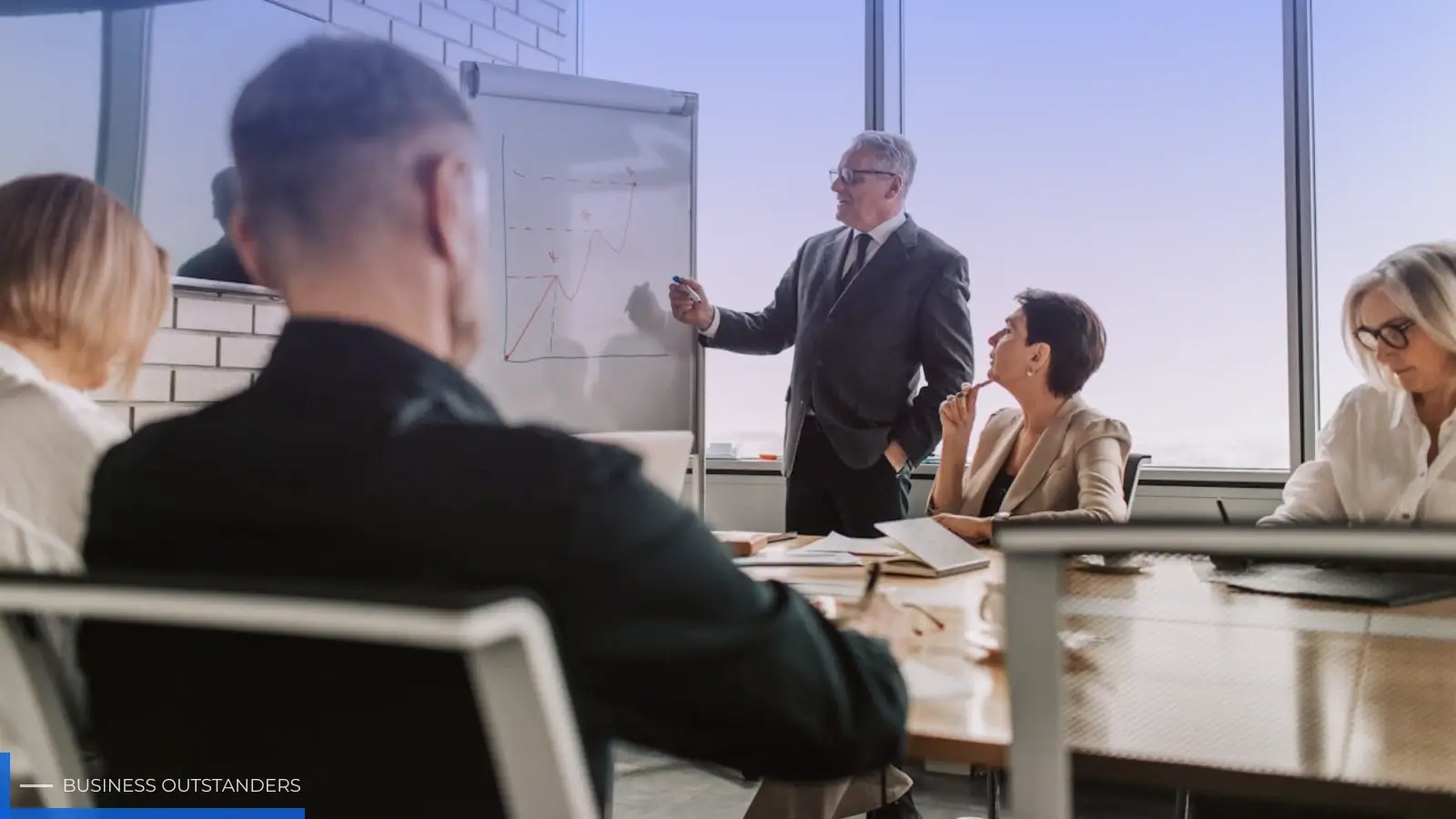 Executive leader presenting strategic vision to a corporate team in a modern boardroom