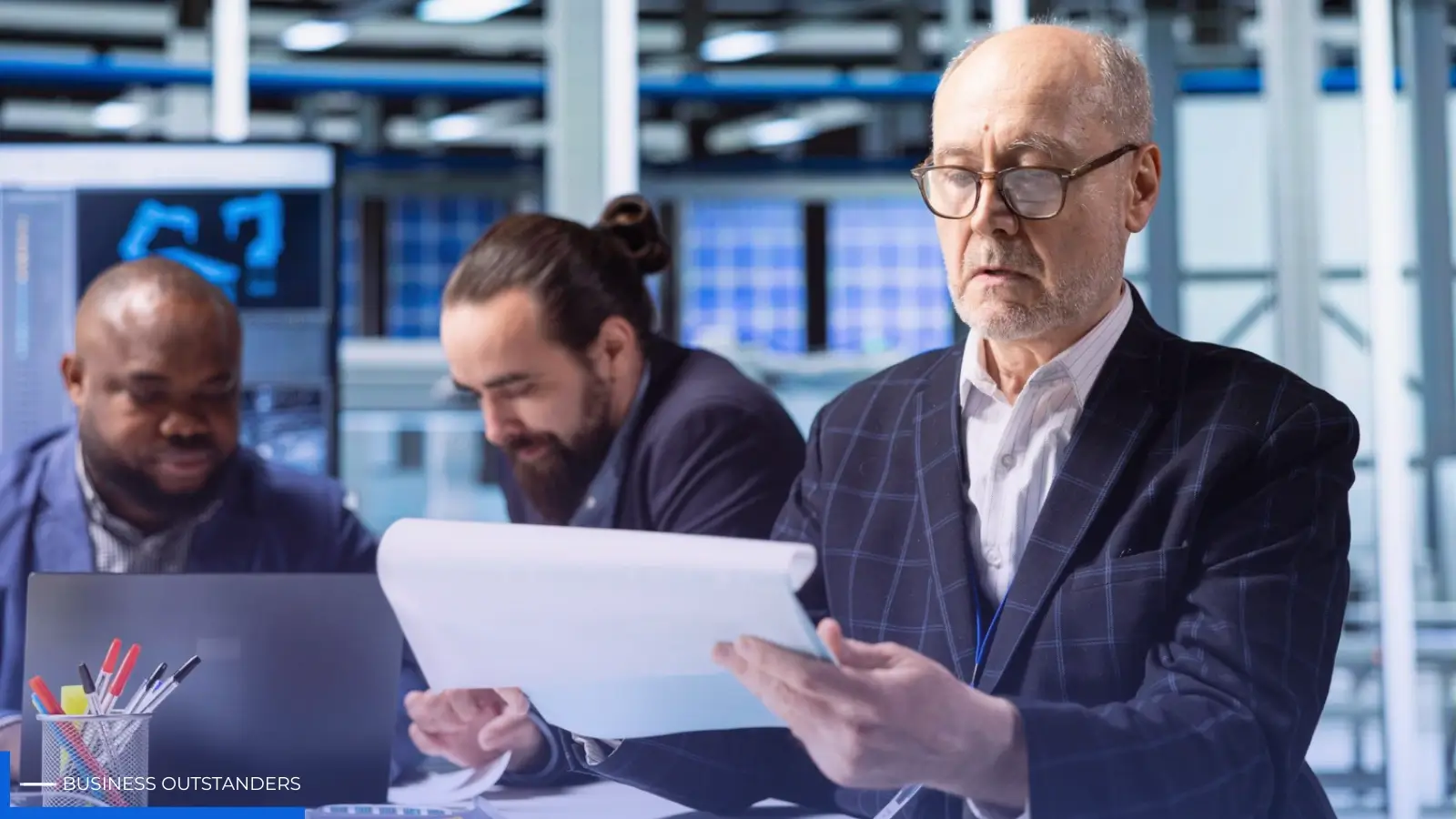 Financial compliance experts reviewing AML regulations and crypto licensing documents for fintech businesses