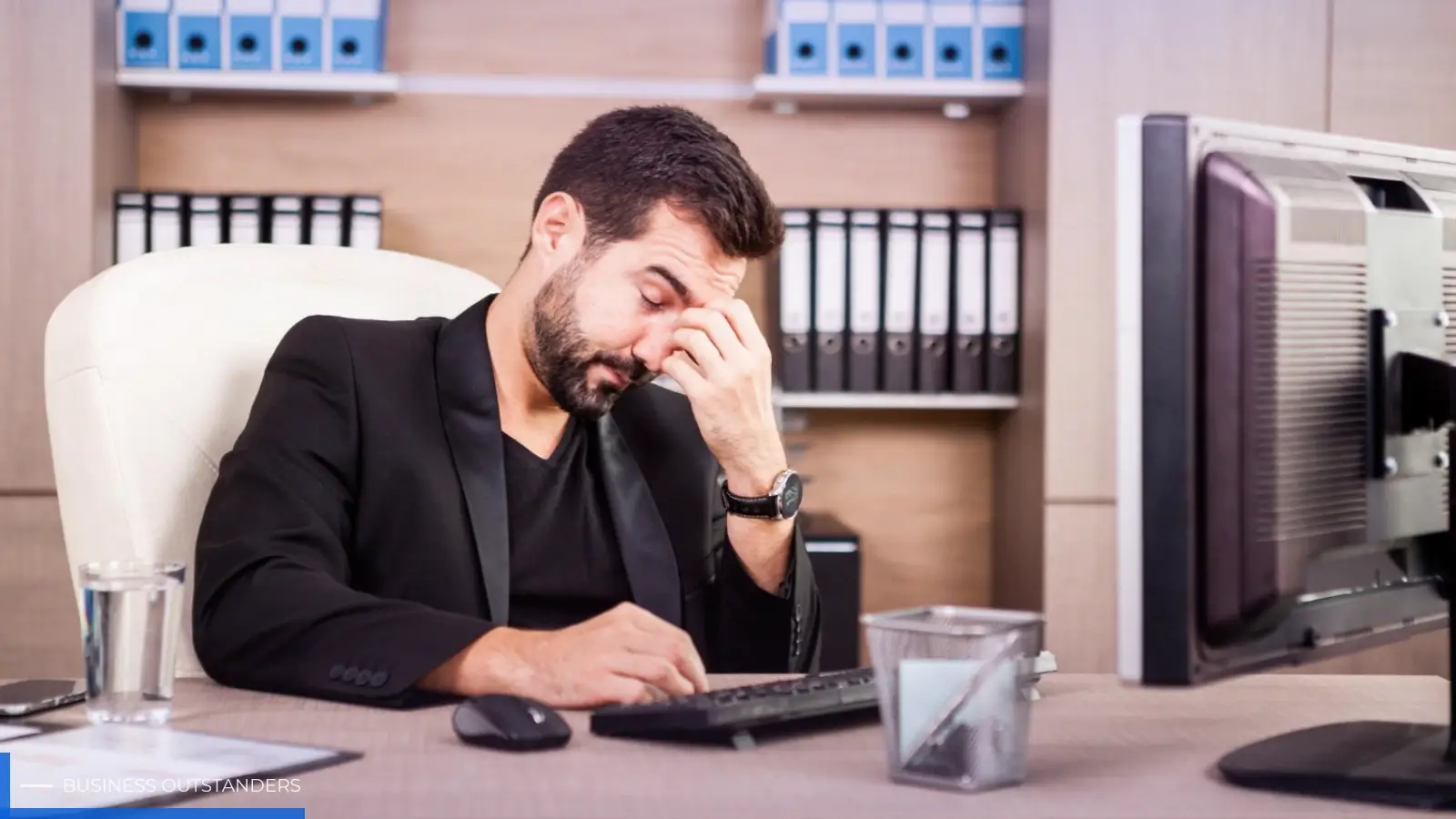 Frustrated employee waiting for slow IT support while business operations are halted