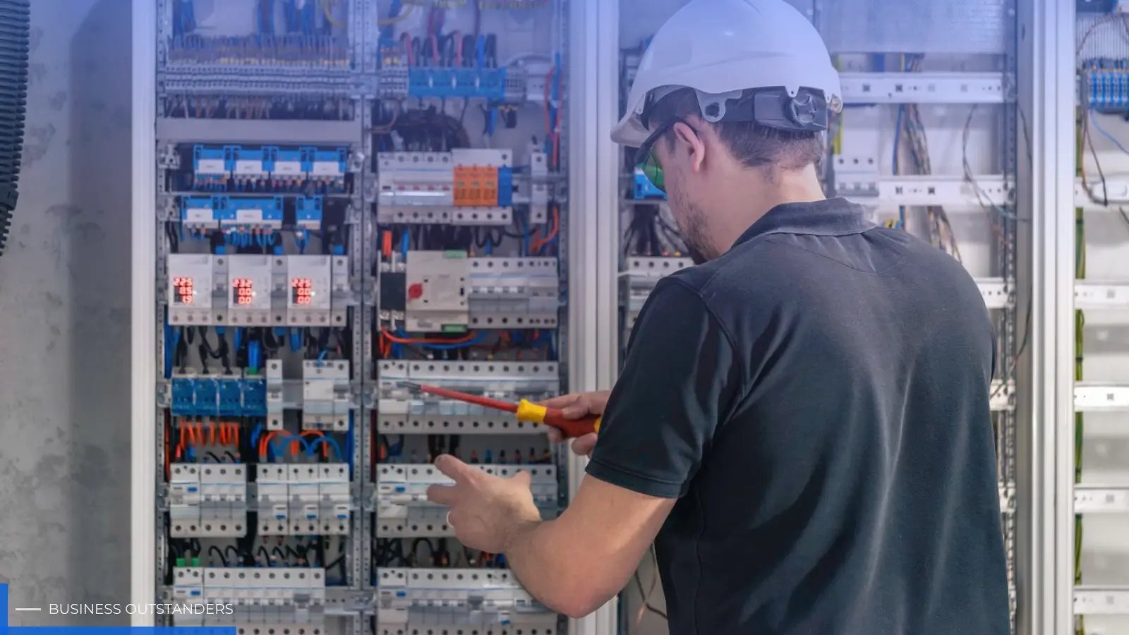 Industrial electrical panel with grounding assemblies and arc-flash protection systems in a modern manufacturing facility