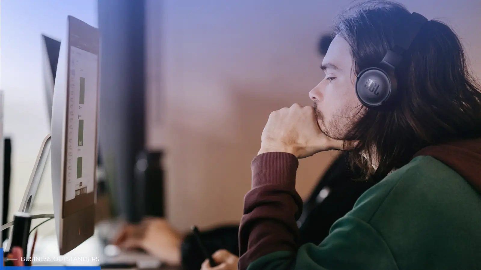 Marketer analyzing digital audio advertising campaign performance on dashboard with headphones and streaming data