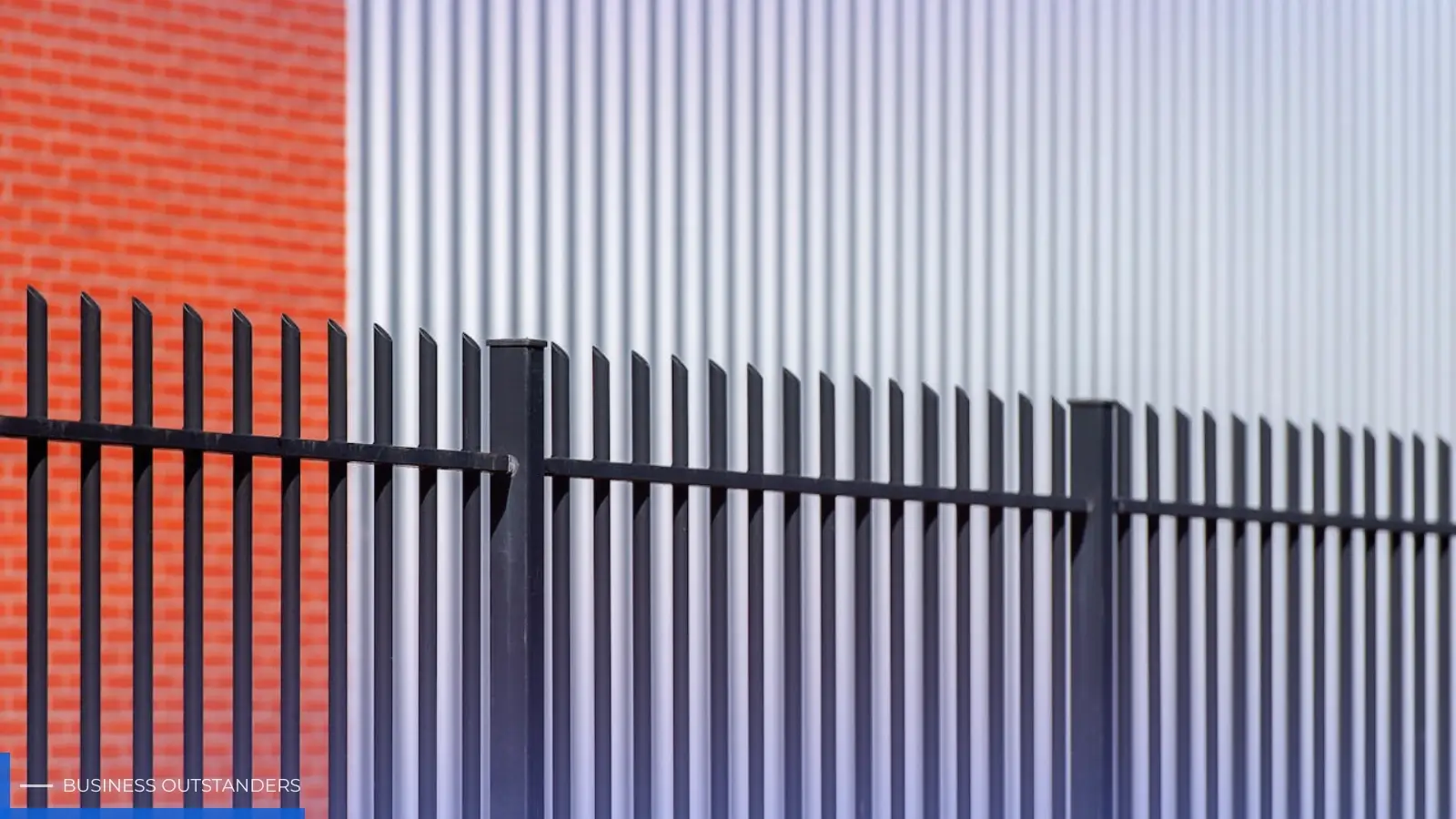 Palisade fence securing a vacant property against trespassing and vandalism