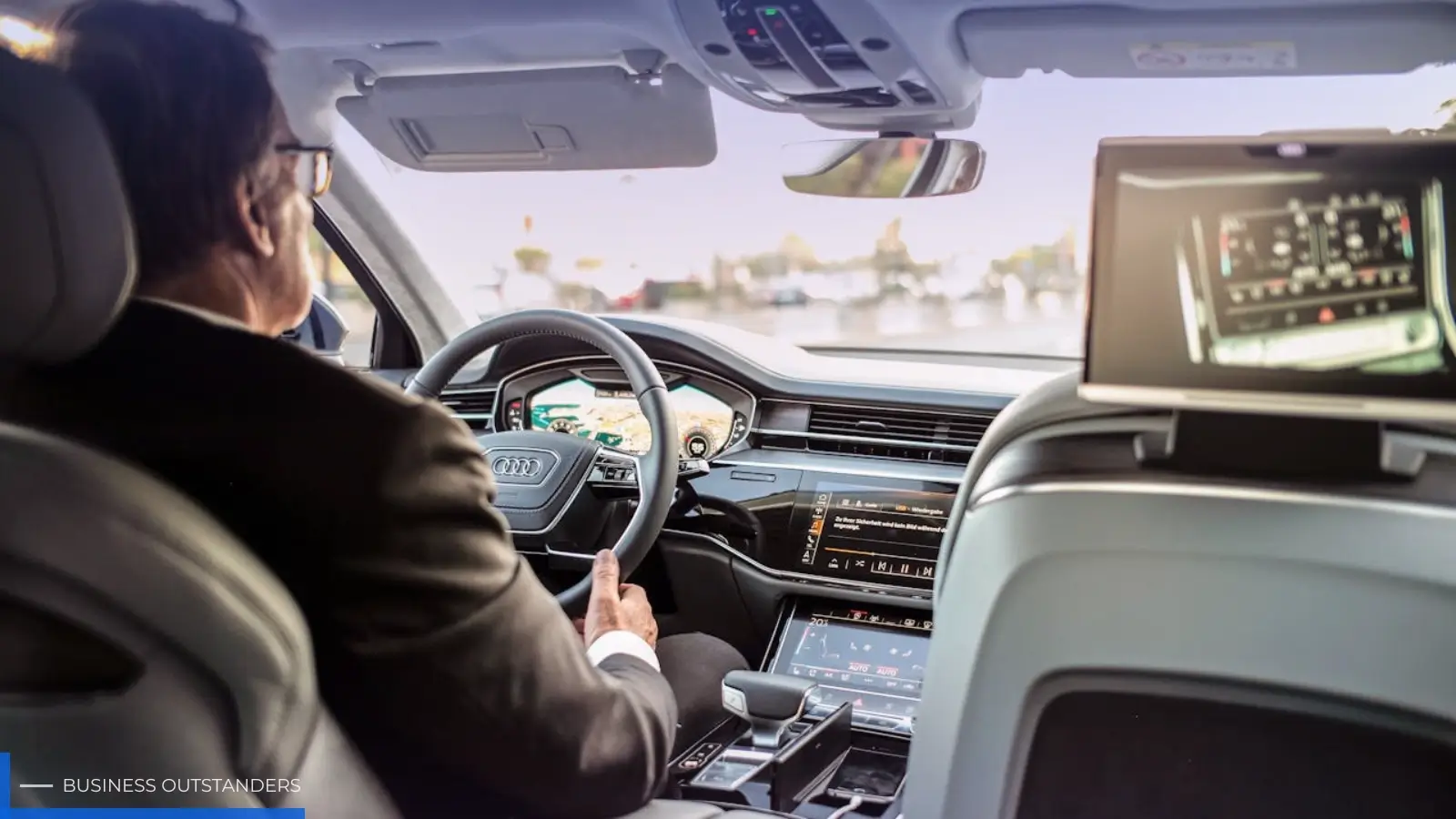 Professional chauffeur driving a luxury vehicle on a long distance highway route