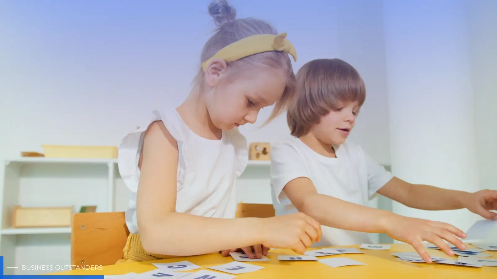 Young child learning Spanish with colorful flashcards and educational materials