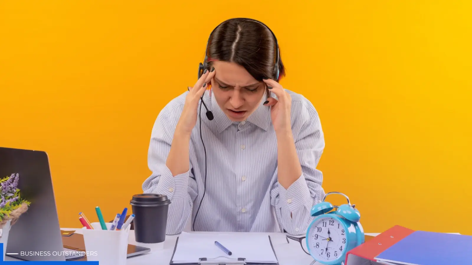 Exhausted BPO call center agent sitting at desk with headset, showing signs of burnout and mental fatigue