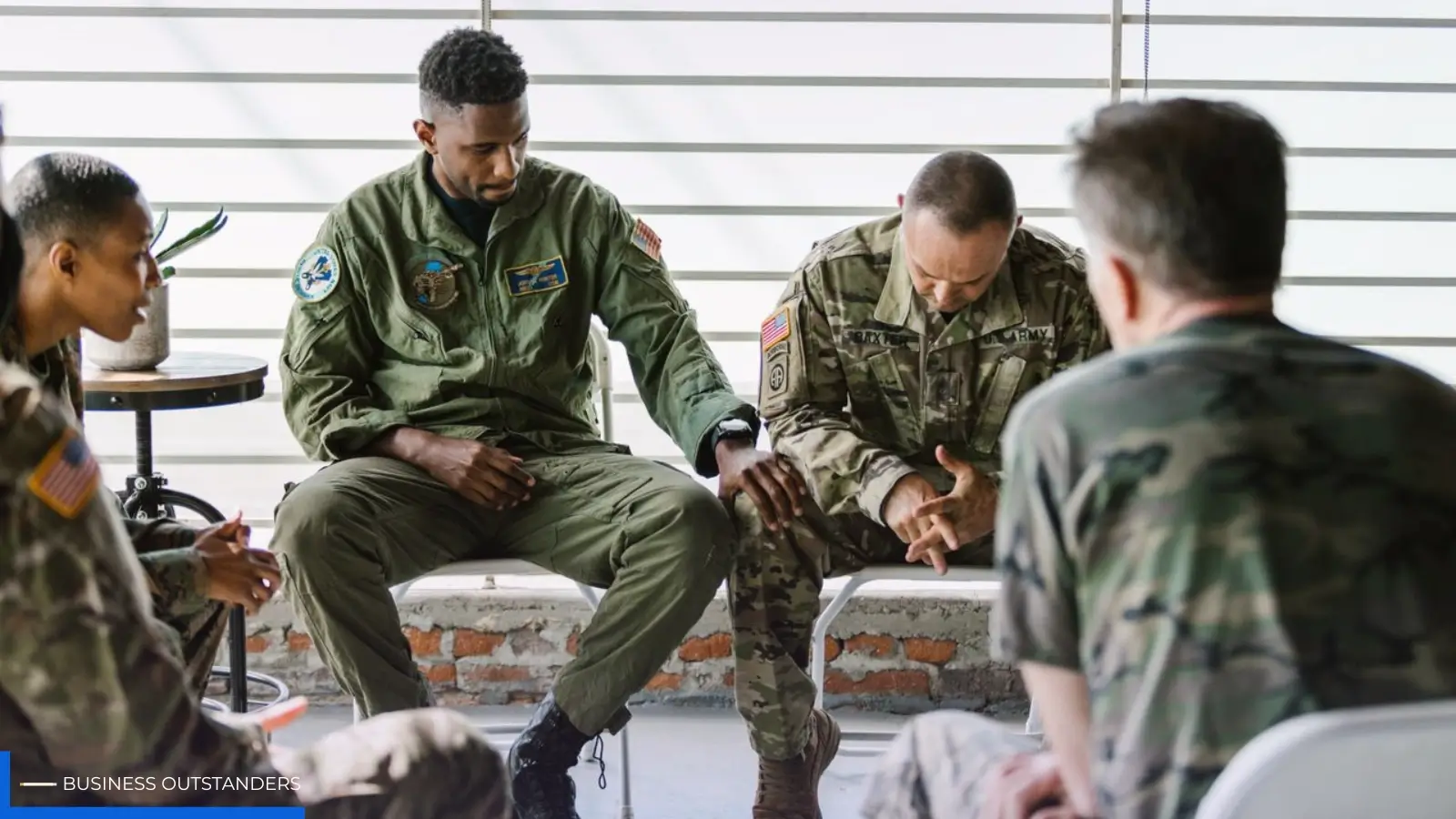 Kentucky veteran sitting quietly at home showing subtle signs of PTSD stress and emotional strain