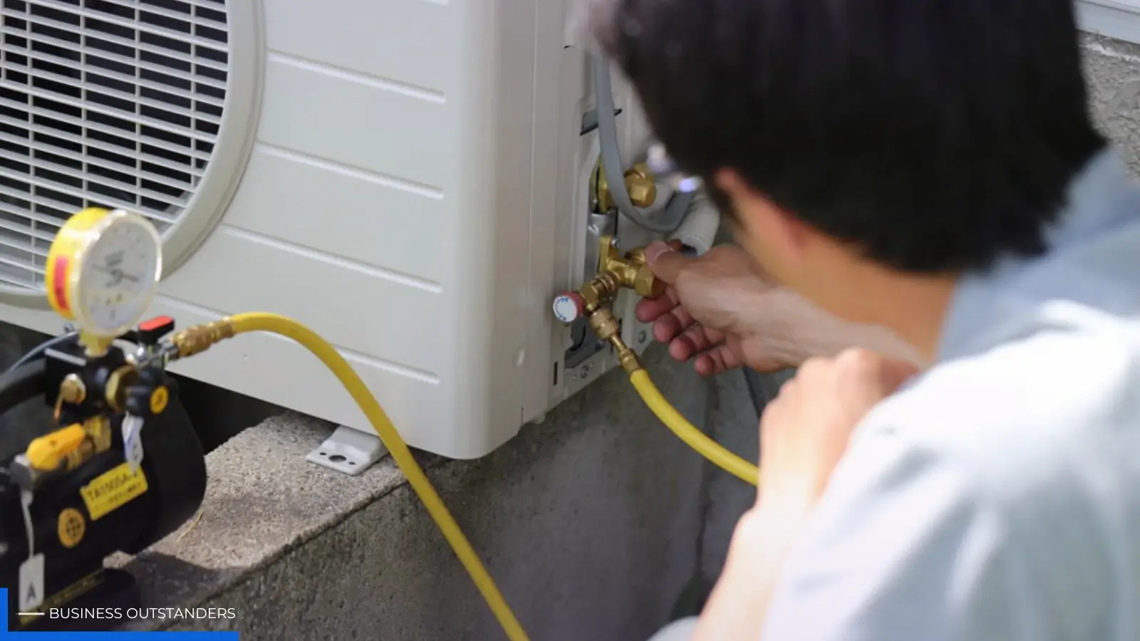 Licensed electrician inspecting and upgrading the electrical switchboard in an older residential home