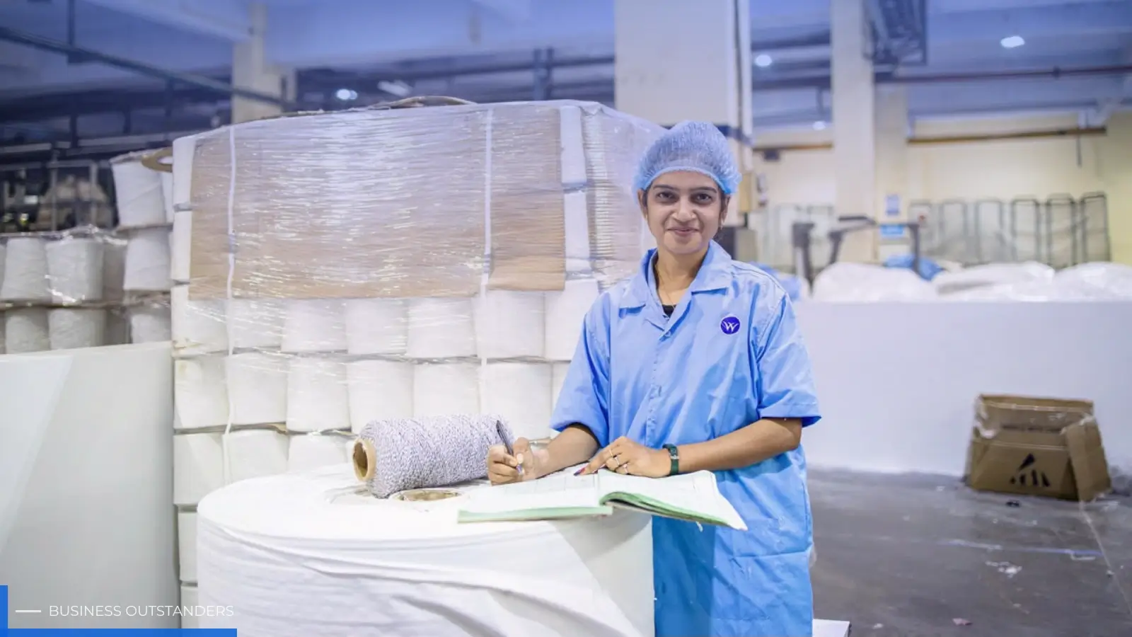 Workers managing materials efficiently in a modern manufacturing facility with digital inventory systems