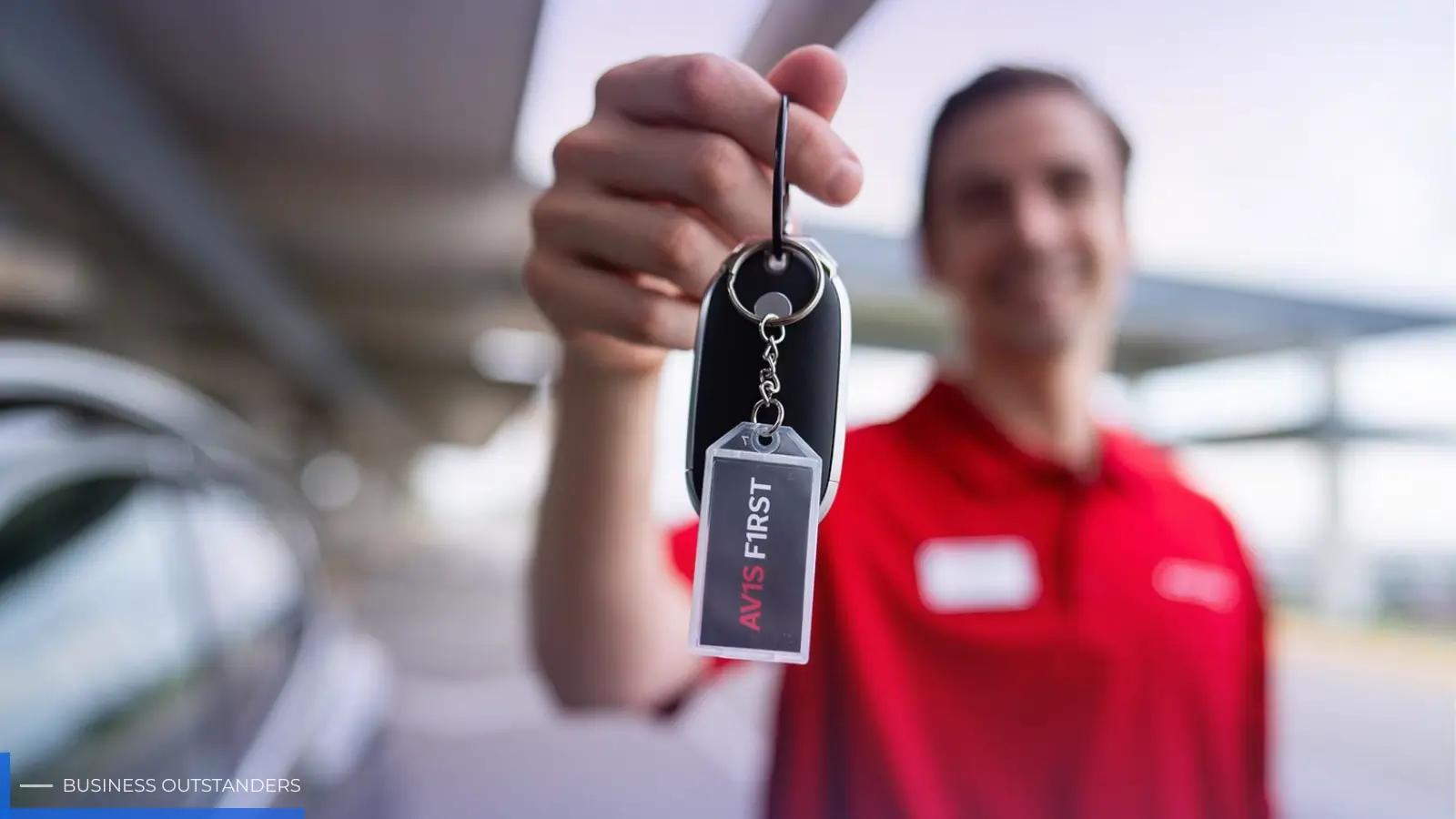 Traveler picking up an Avis rental car at the airport ready for a road trip