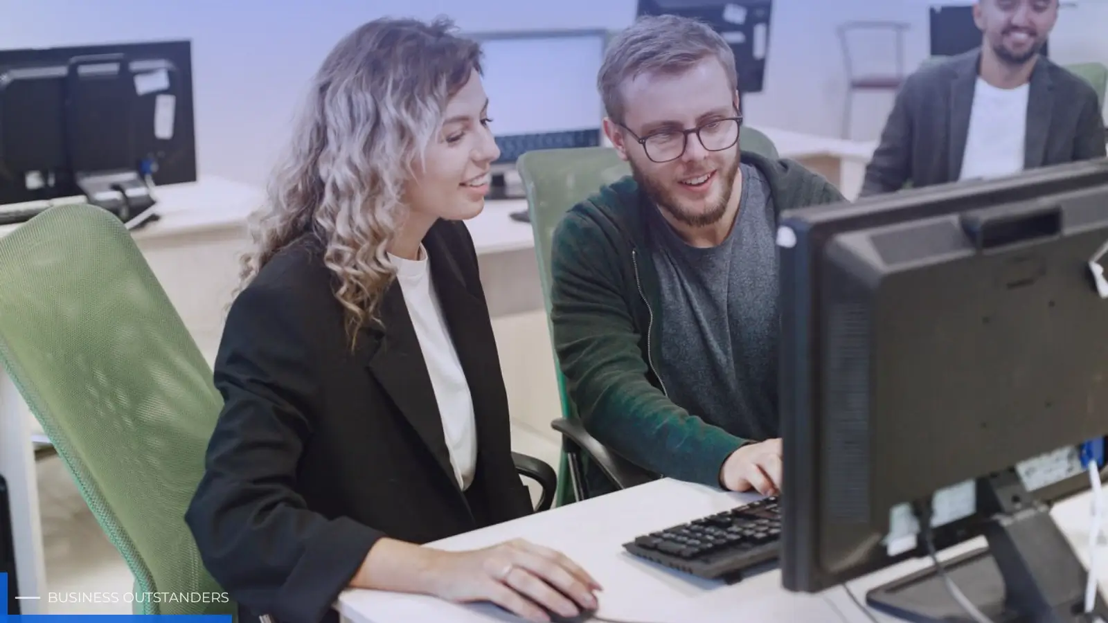 IT support technician monitoring business network systems for proactive maintenance and uptime
