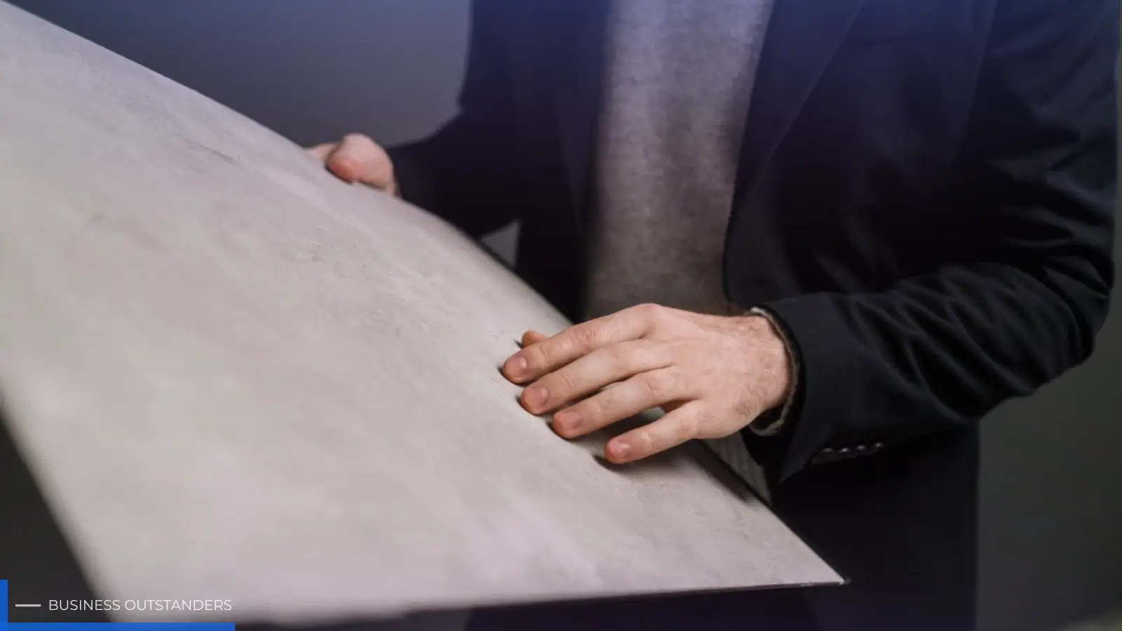 Engineer examining the material durability of a kitchen appliance countertop product under stress conditions