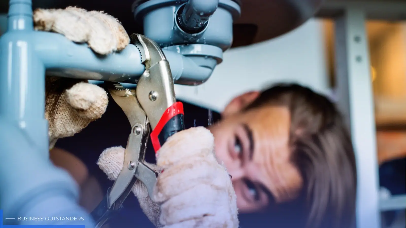 Licensed local plumber repairing a burst pipe during a home plumbing emergency