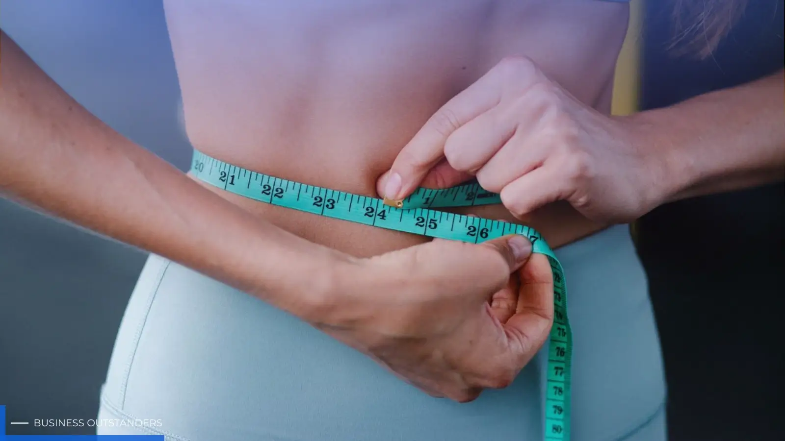 Person celebrating major weight loss transformation