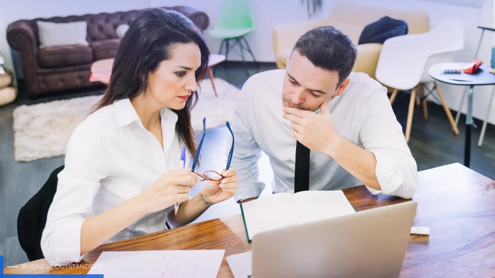Investor reviewing non-performing loan documents and risk analysis reports