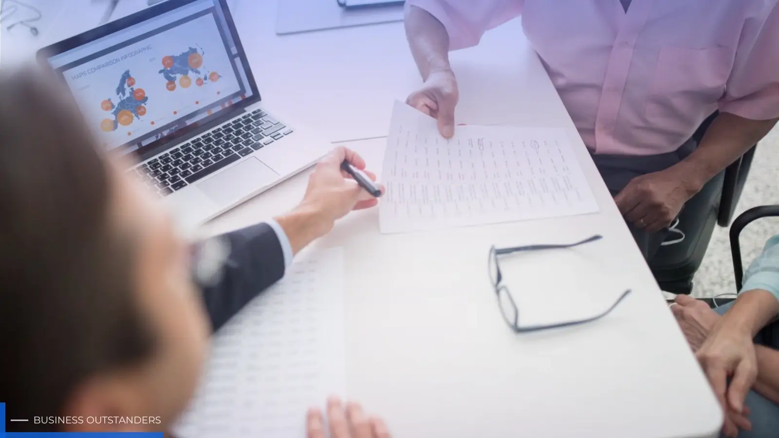Business professionals reviewing offshore company setup documents with global map and financial charts