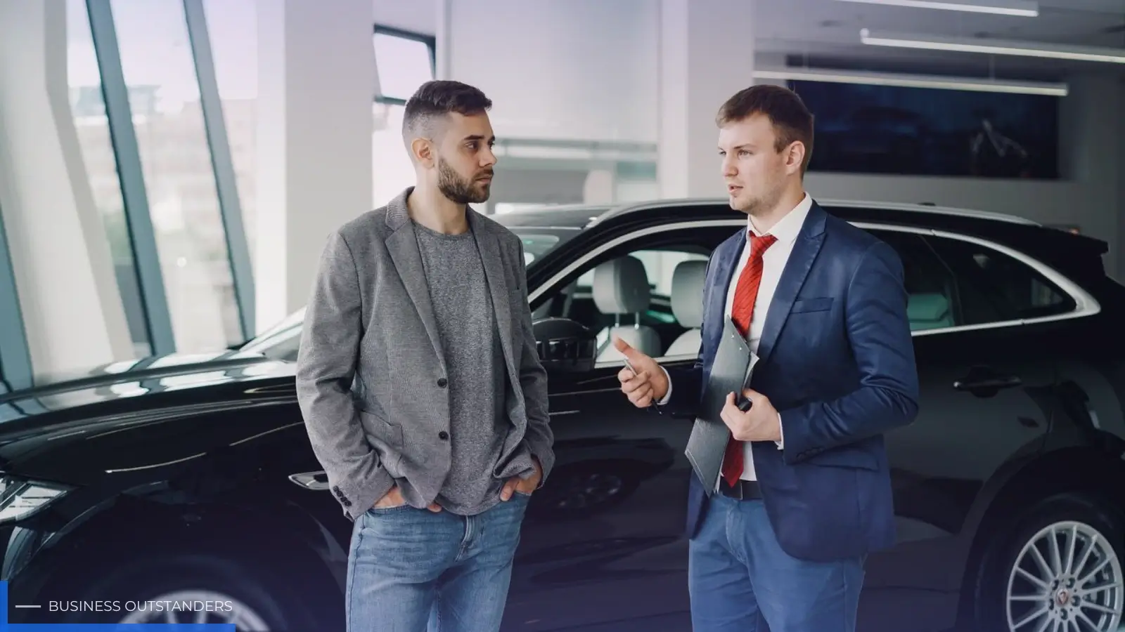 Business owner evaluating a company car at a dealership for professional use
