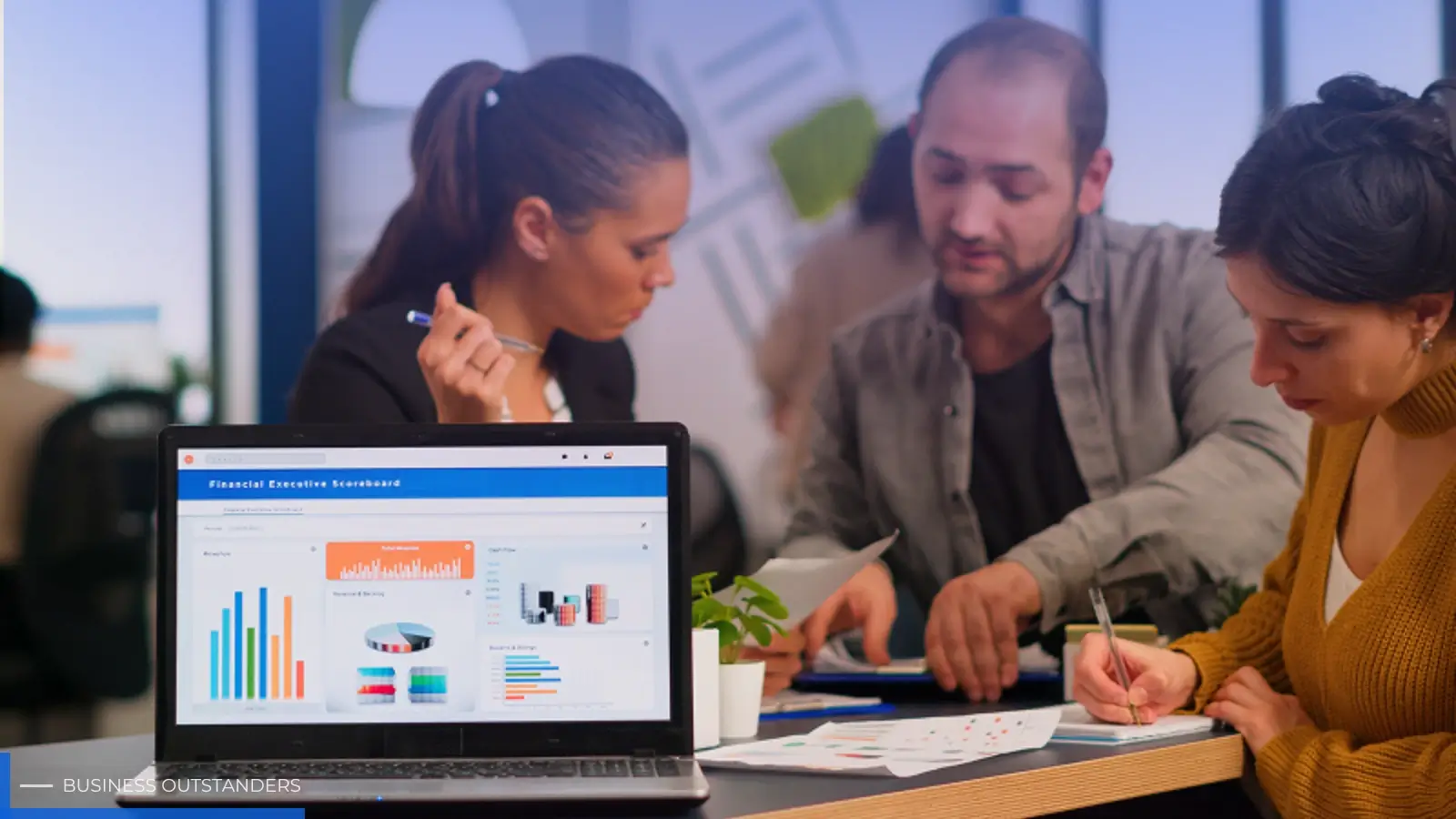Business professional reviewing 30-day social media marketing performance metrics on a laptop