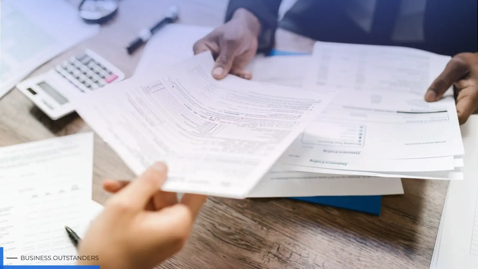 Business professionals reviewing tax compliance documents and digital financial systems for Southeast Asia expansion