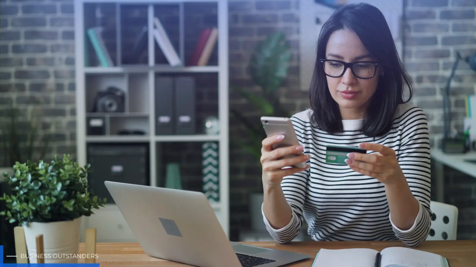 Entrepreneur reviewing eCommerce business strategy on laptop with product and analytics data